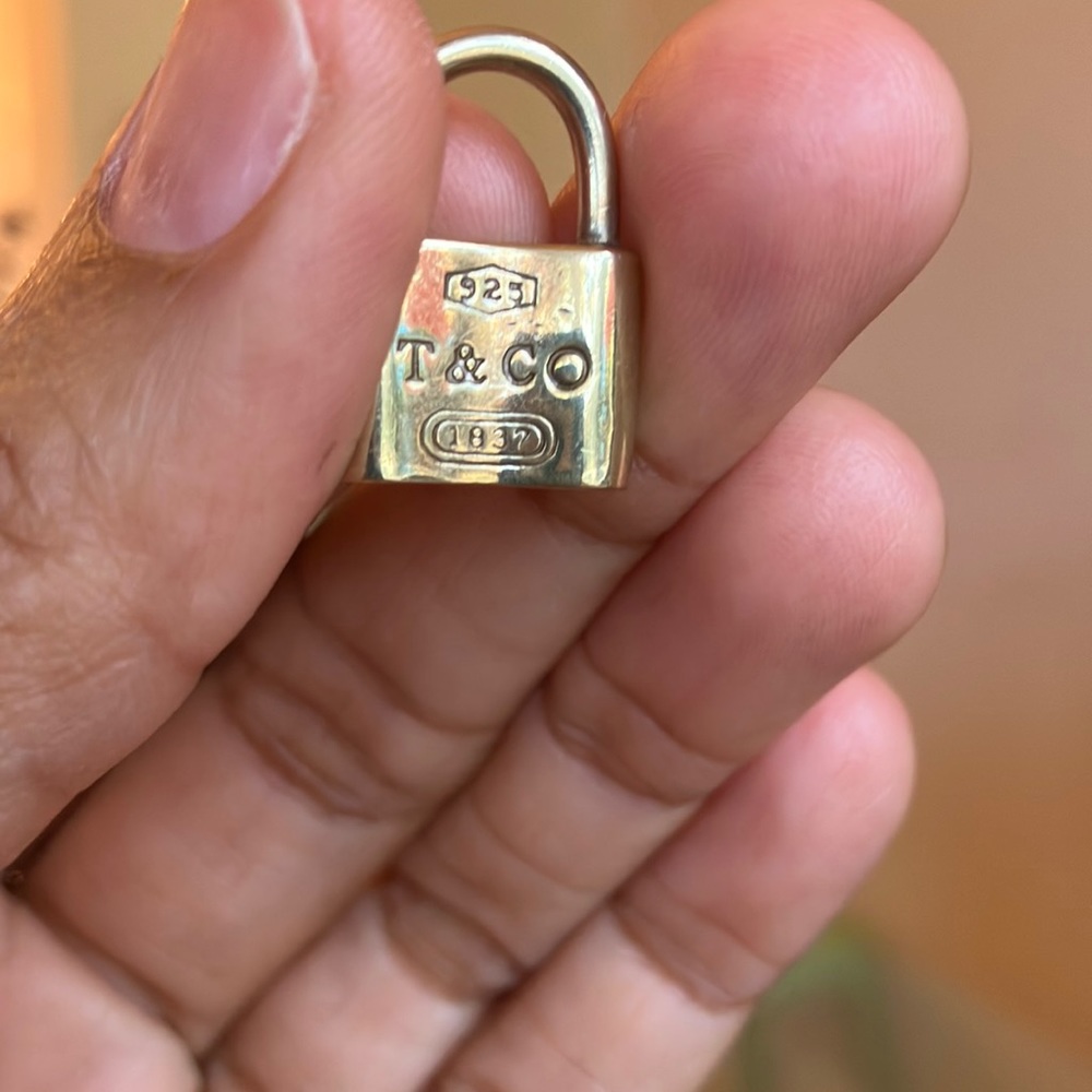 Tiffany&Co Lock pendant. Authentic. Looks as if it was previously gold plated